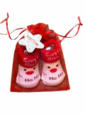 Baby Christmas socks in a gift bag